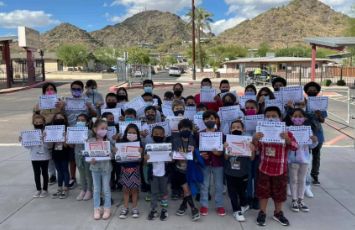  students show off certificates